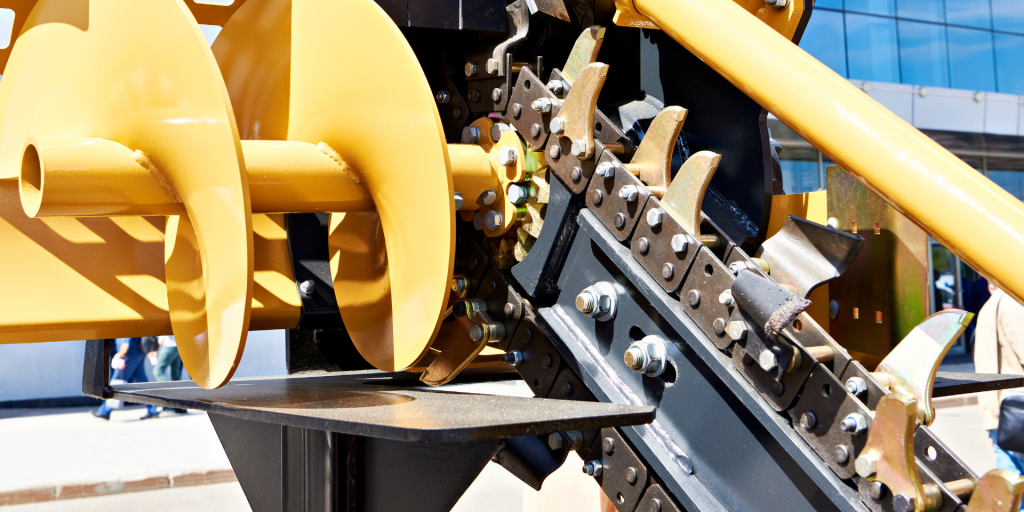 Zoomed in yellow Trencher machine